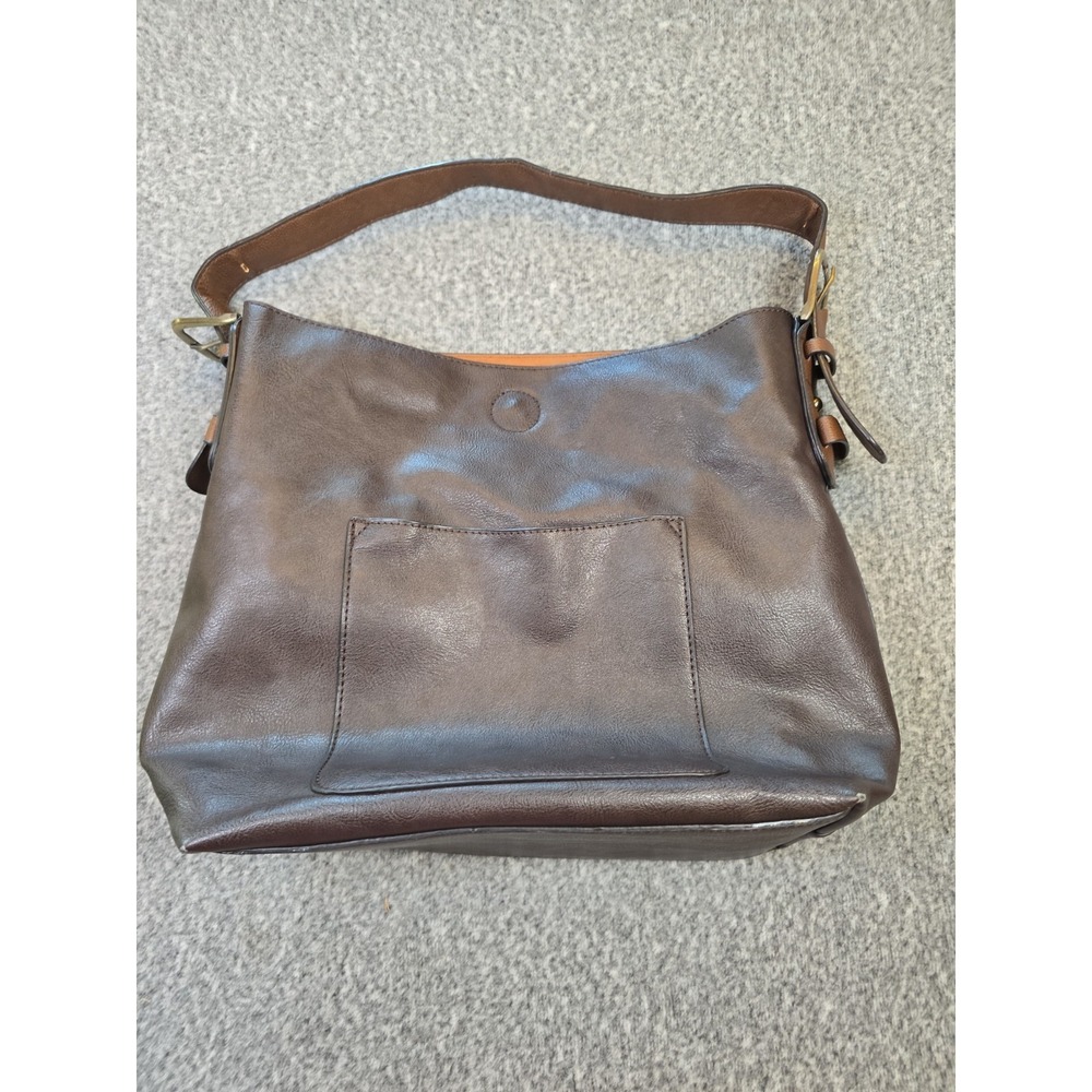 Joy Susan Brown faux leather hobo handbag features a neutral-toned shoulder